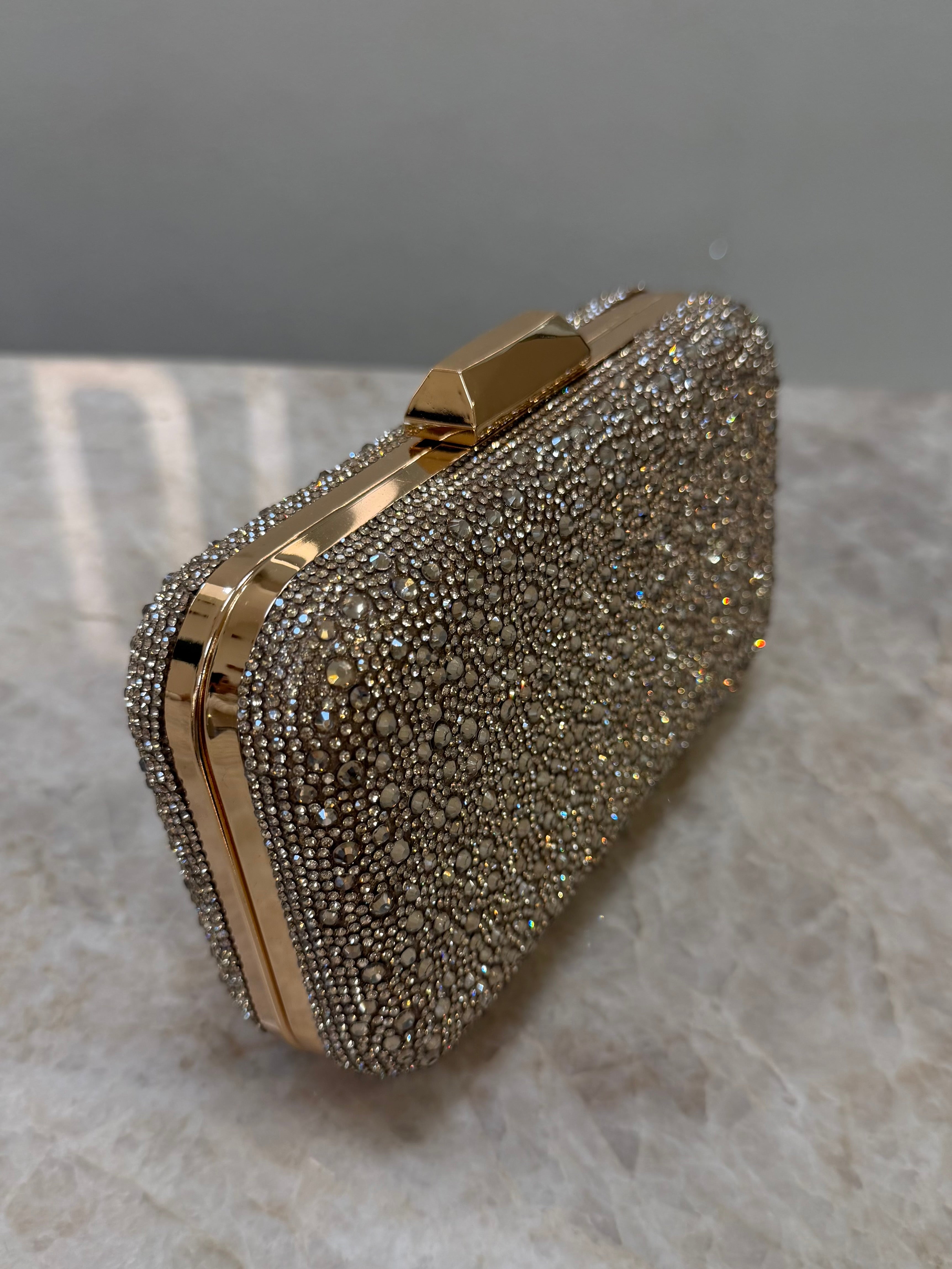 CLUTCH STRASS DOURADA
