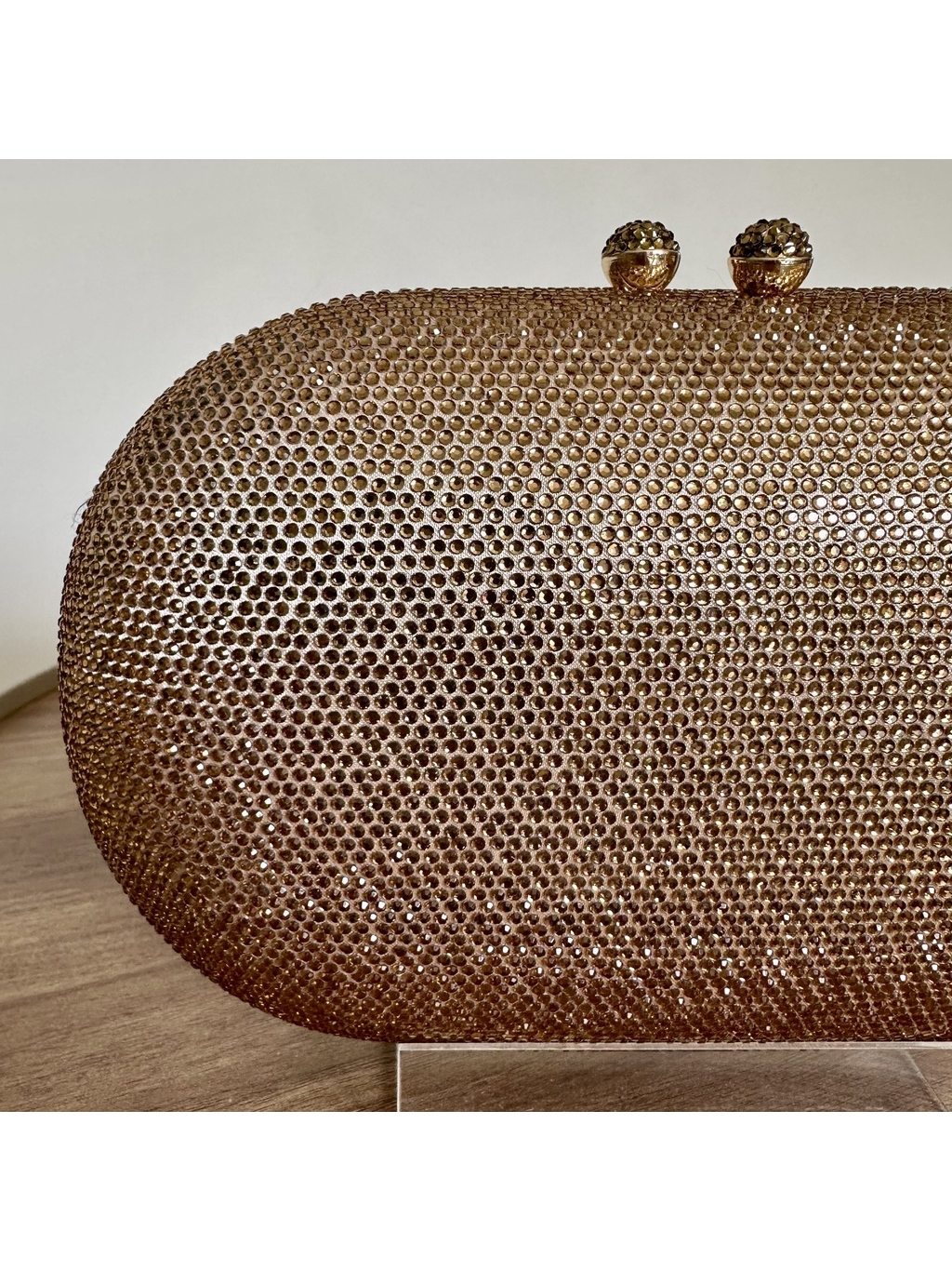 CLUTCH STRASS DOURADA OVAL